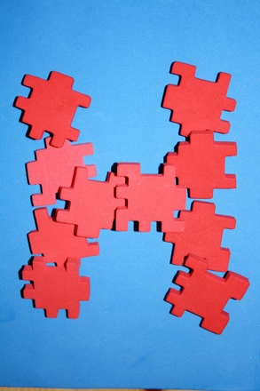Play a Puzzle Piece Spelling Game